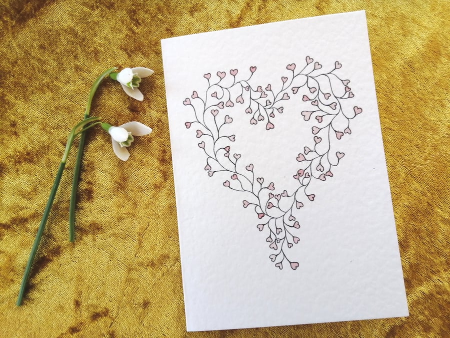 Romantic card with watercolour hearts design
