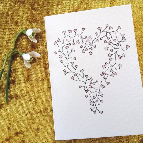 Romantic card with watercolour hearts design