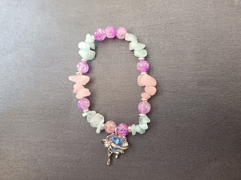 Elasticated beaded pastel coloured bracelet with heart and star charm 