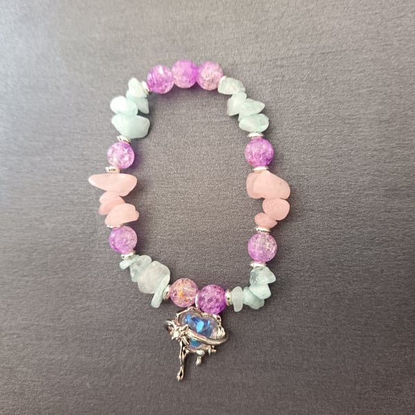 Elasticated beaded pastel coloured bracelet with heart and star charm 