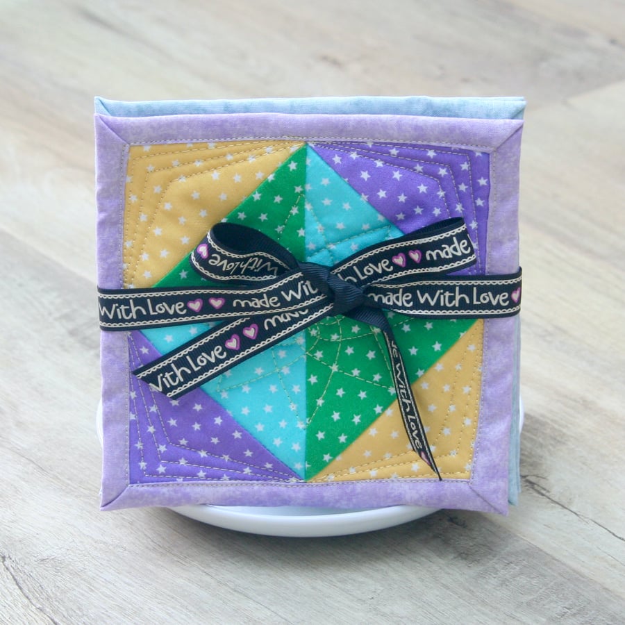 Coaster Set - four coasters with Green, Yellow, Blue and Purple stars fabric.