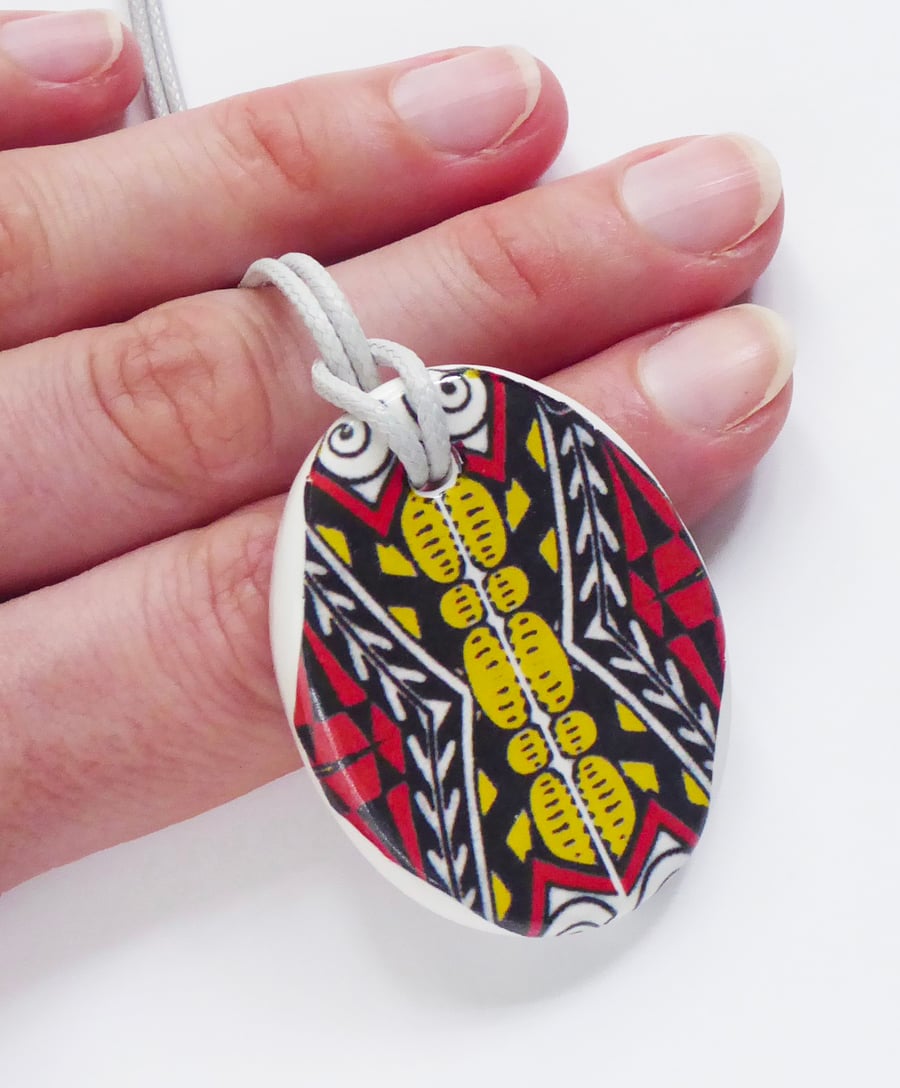 Red Black and Yellow Oval Ceramic Pendant on Grey Cord with Lobster Clasp