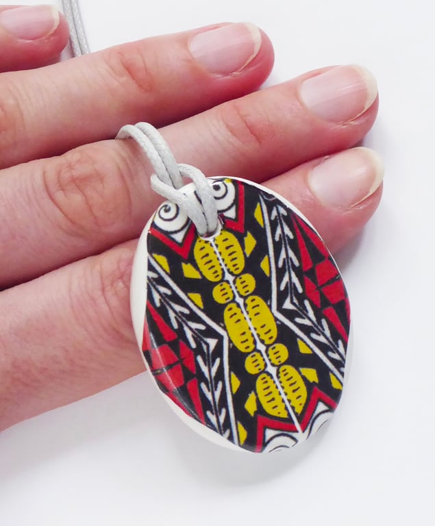 Red Black and Yellow Oval Ceramic Pendant on Grey Cord with Lobster Clasp