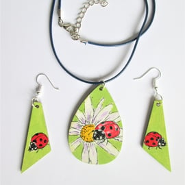 Ladybug on white Flowers. Pendant and Earrings set
