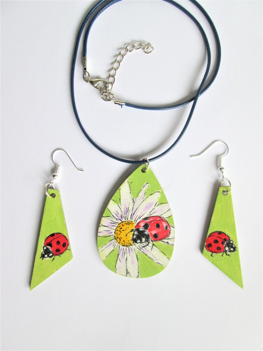 Ladybug on white Flowers. Pendant and Earrings set
