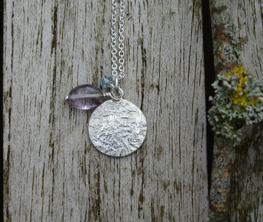 Textured recycled Eco Silver disc pendant with amethyst and aquamarine