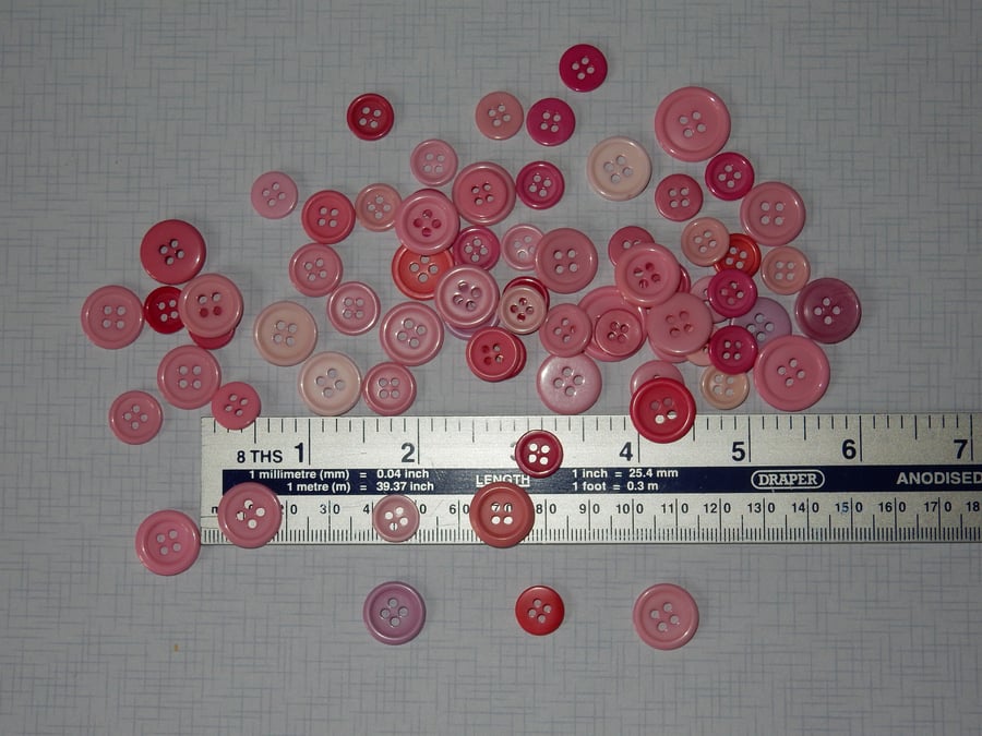Bumper back of assorted pink buttons