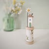 Wooden House on a Floral Bobbin with Clay Daisy