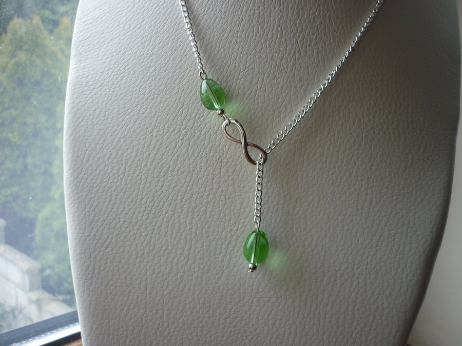 GREEN AND SILVER INFINITY LARIAT DESIGNED NECKLACE.