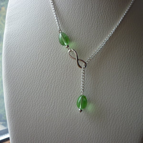 GREEN AND SILVER INFINITY LARIAT DESIGNED NECKLACE.