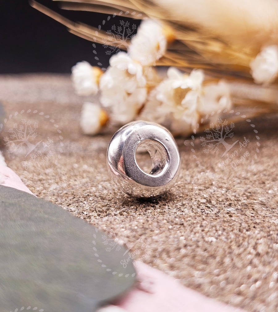 Ashes into fine recycled silver universal charm bead.