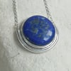 Lapis Cabochon in a Silver Semi Circle Necklace