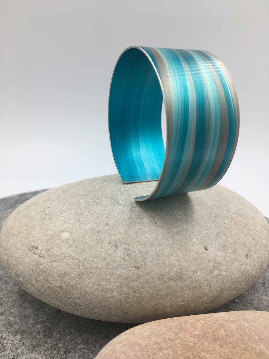 Turquoise and grey anodised aluminium striped cuff