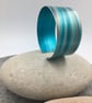 Turquoise and grey anodised aluminium striped cuff - Image 1