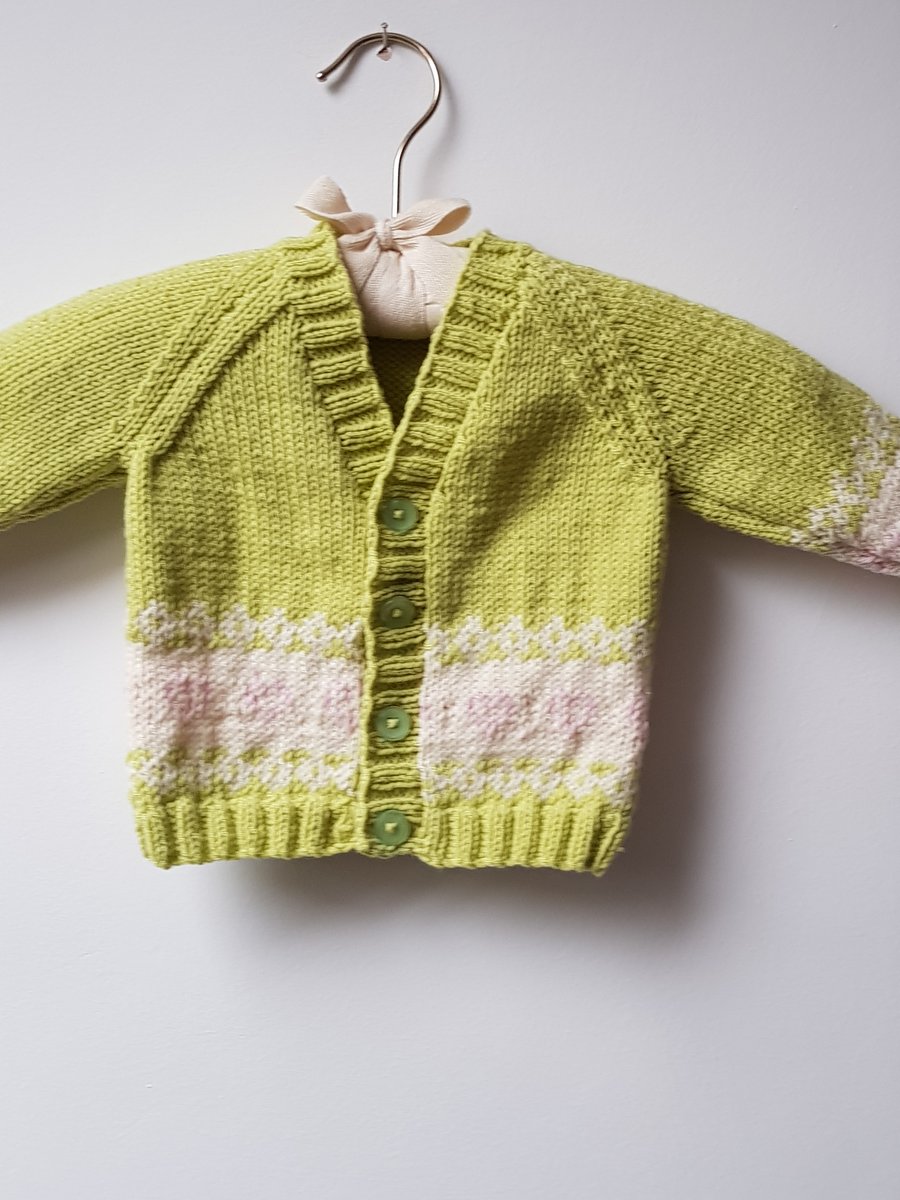 6-12 months hand knitted cardigan, pea green with pale pink hearts