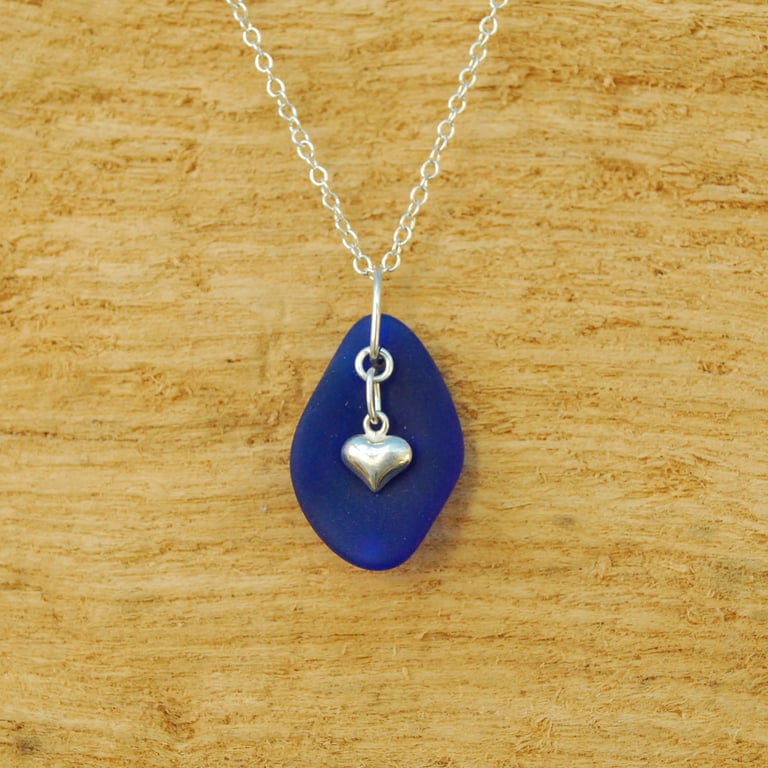 Blue beach glass pendant with heart charm