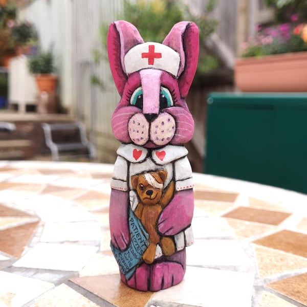 Hand carved and painted, Nurse Raspberry Rabbit