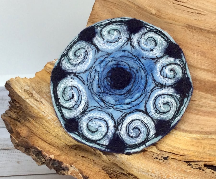Embroidered needle felted Celtic spiral brooch. 