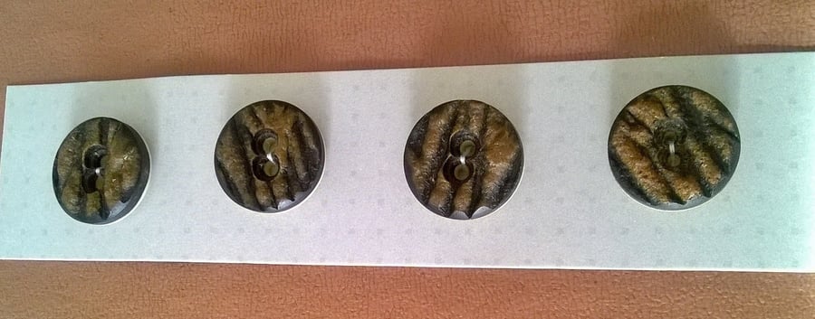 Set of  four brown two hole  vintage buttons 