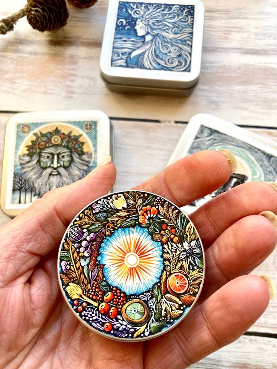 Storage tin winter wreath stitch markers, beads, knitting and sewing