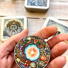 Storage tin winter wreath stitch markers, beads, knitting and sewing