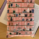 Shelves With Trinkets And Dogs Print Quilted Fabric Book Sleeve - Hardback Size