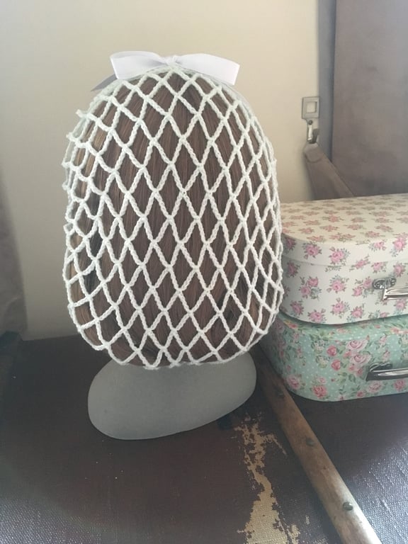 Pastel green 1940s style retro ribbon snood hairnet with a white ribbon