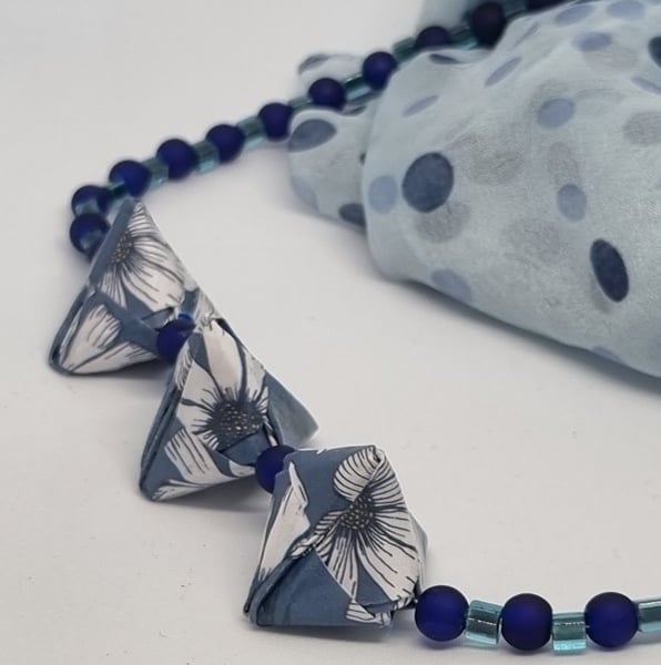 Handmade origami necklace: blue floral paper and small blue beads 