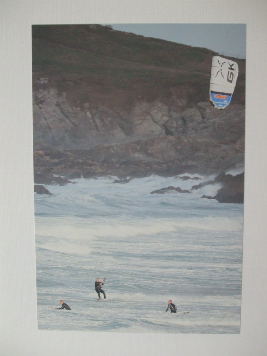 Photographic greetings card of a kite surfer with 2 surfers.