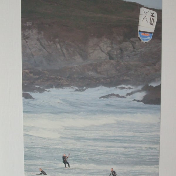 Photographic greetings card of a kite surfer with 2 surfers.