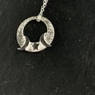 Silver circular moon and stars pendant