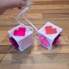 Novelty hanging cubes with pink hearts and sucker-cup attachment 