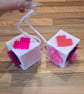 Novelty hanging cubes with pink hearts and sucker-cup attachment 
