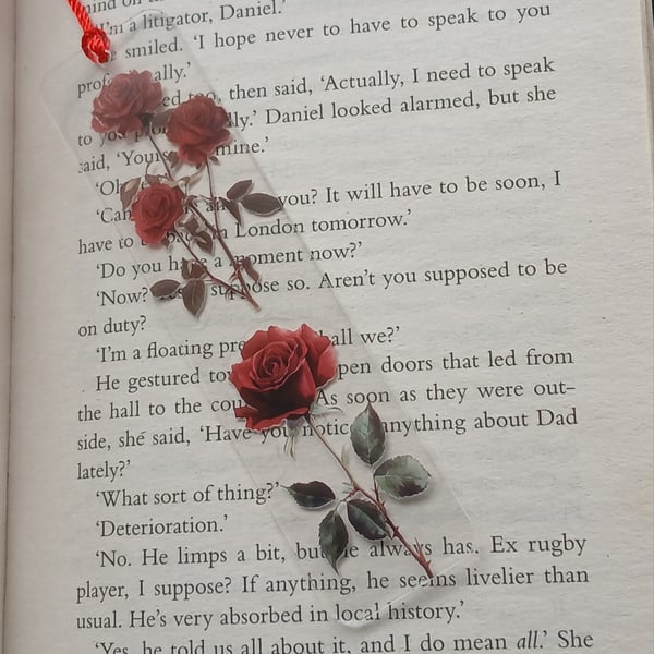 Clear acrylic bookmark decorated with red flowers decals 