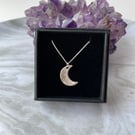 Sterling silver clay mini crescent moon pendant on a sterling silver chain.