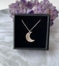 Sterling silver clay mini crescent moon pendant on a sterling silver chain.