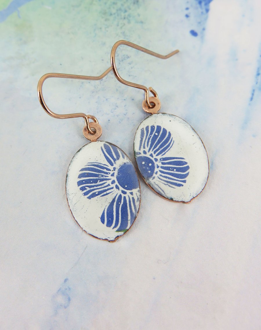 Dangle earrings with white enamel and blue flower pattern