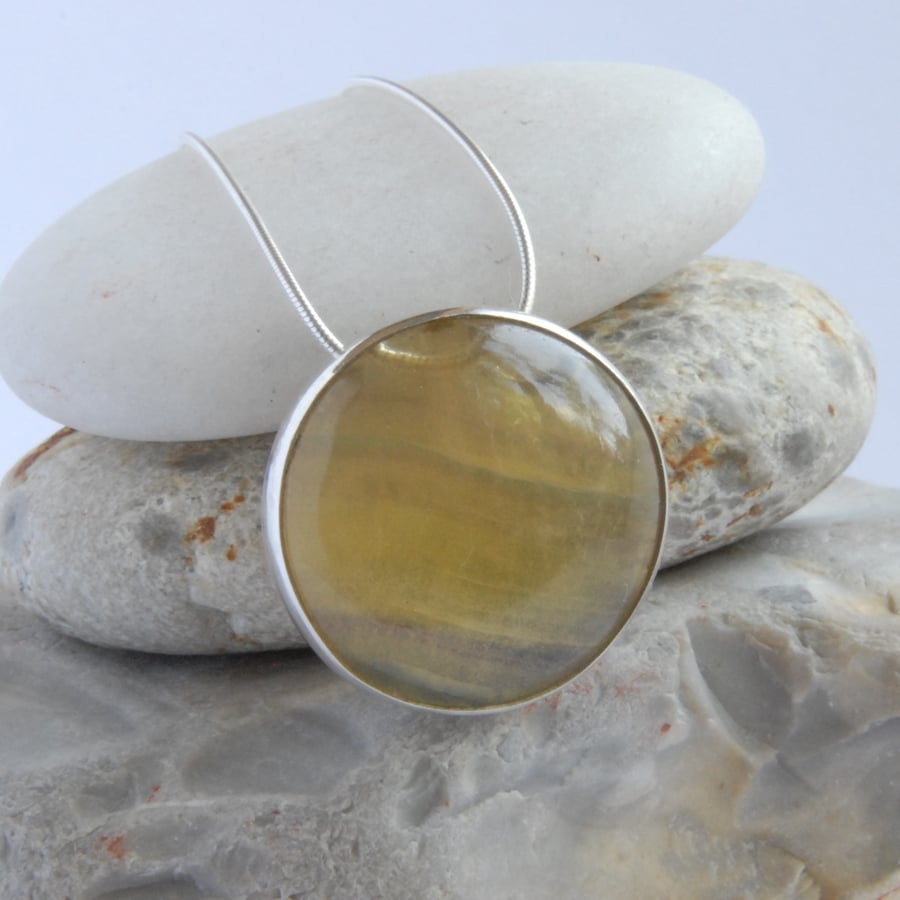 Sterling silver and golden yellow fluorite circular slider pendant