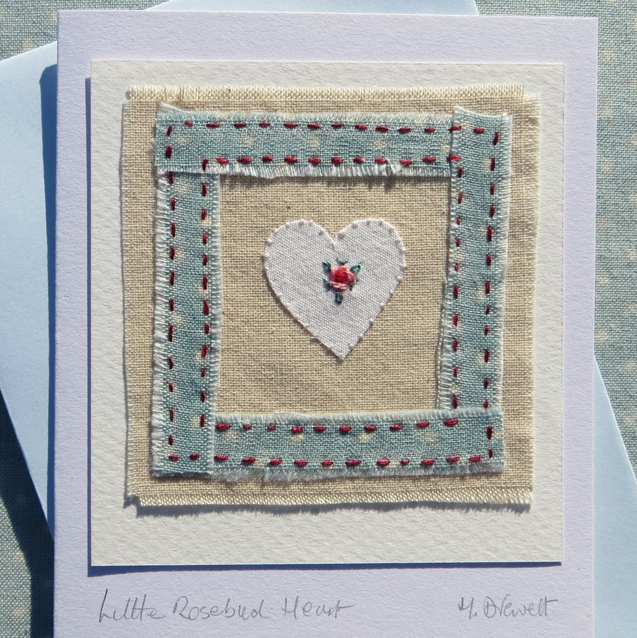Hand-stitched miniature embroidery worked on heart mounted on greeting card