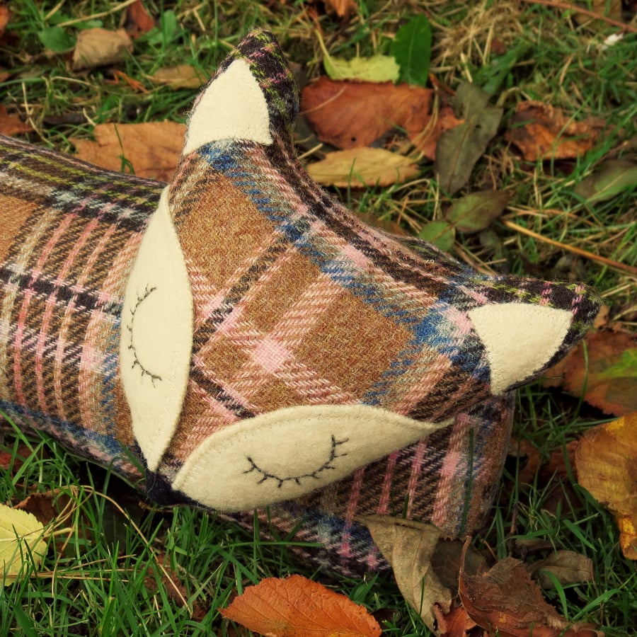 Long Fox. A draught excluder made from a tactile tartan wool.