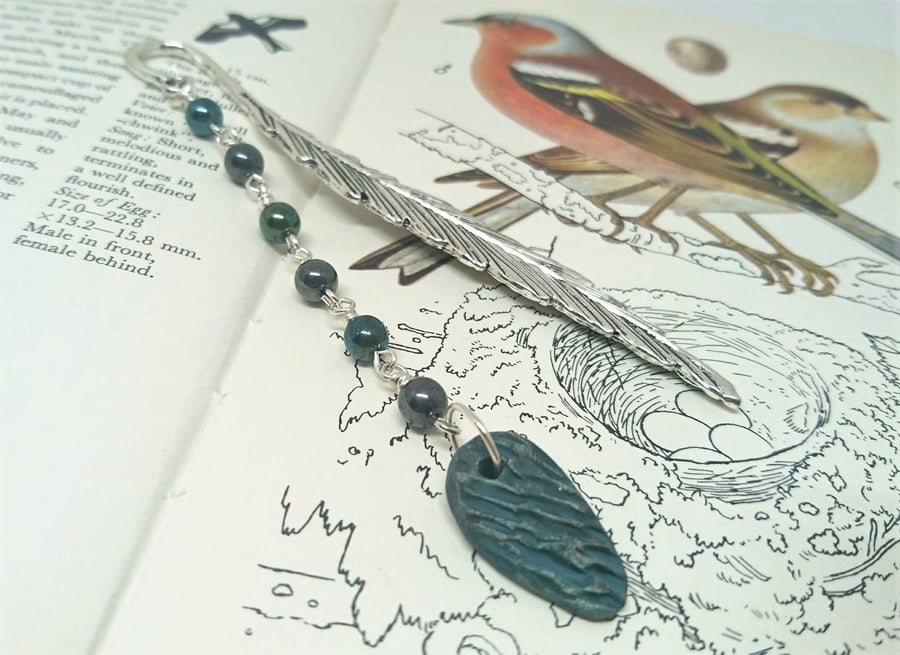 Feather bookmark with ceramic charm and metallic look beads