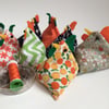 A set of eight chicken pattern weight bean bags for dressmaking.