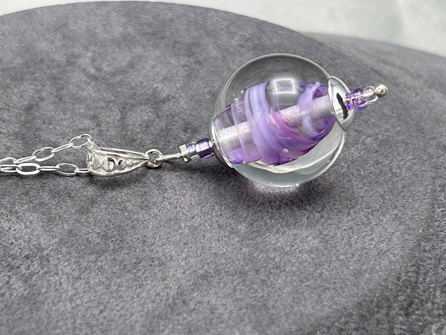 Image of purple and clear swirly glass ball shaped lampwork glass pendant necklace
