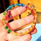 Rainbow beaded double wire bracelet with two hanging beads to finish