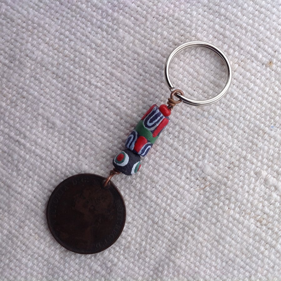 Keyring with 1892 old penny and African beads