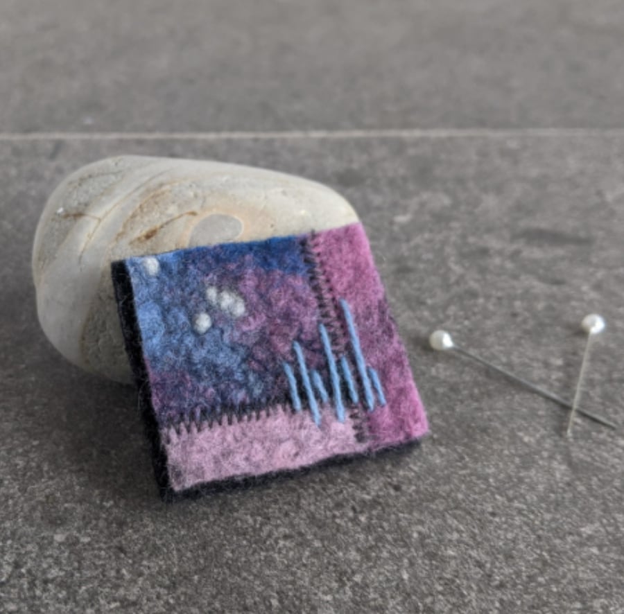 Felted patchwork brooch in shades of pinks and blue