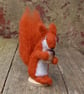 Needle felt red squirrel holding an acorn - Image 1