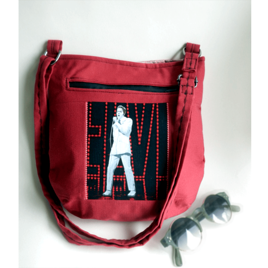 Small, red crossbody bag with Elvis image