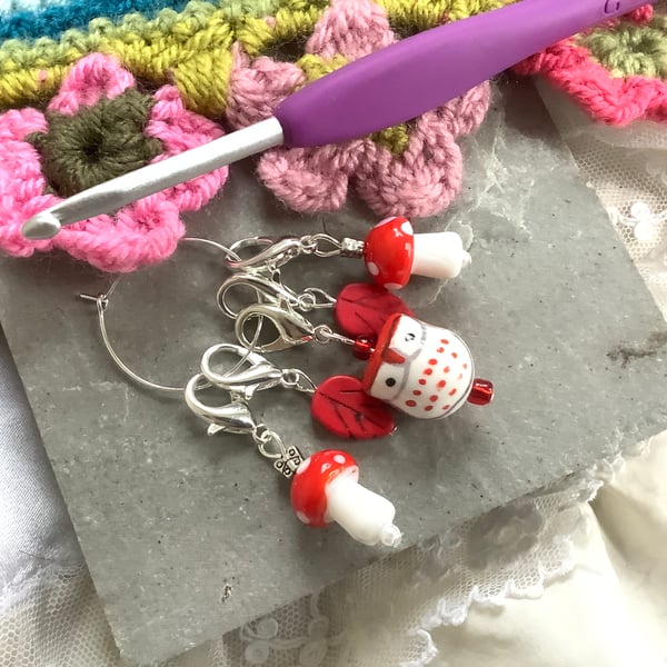 Crochet stitch markers, red owl, leaf, and mushrooms, woodland theme. 
