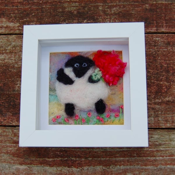 Needlefelt sheep holding a bouquet    
